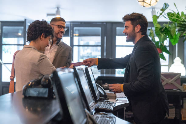 Hotel staff providing personalized service to a guest
