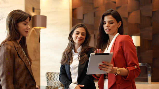 Hotel management students learning hospitality technology and digital hotel operations
