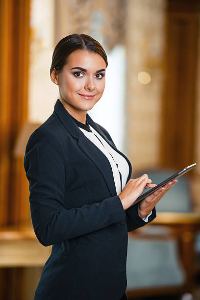 Hospitality professional assisting passengers at an airport