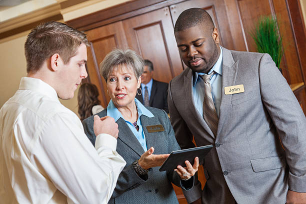 Hotel management professional coordinating a wedding hospitality event